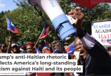 Pastor Dieufort Fleurissaint denounces the hateful rhetoric aimed at Haitian migrants in Springfield, Ohio, during a Sept. 24, 2024, rally in Boston. Jessica Rinaldi/The Boston Globe/Getty Images)